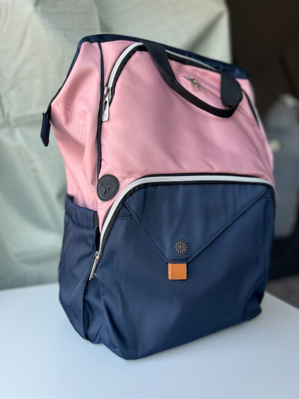 Unisex wide-mouth backpack with multiple pockets in pink and blue